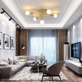 Modern living room with gray sectional sofa, coffee table, and television.